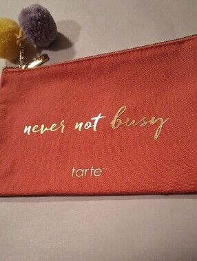 tarte Makeup Pouch "never not busy" with Removable Yellow and Purple Pom-Poms